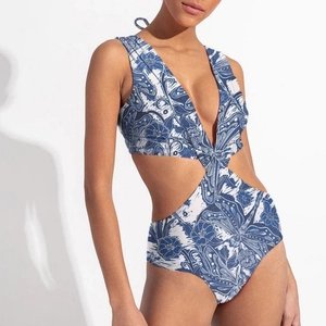 Blue and white floral one-piece swimsuit with waist cut-outs and halter neck tie
