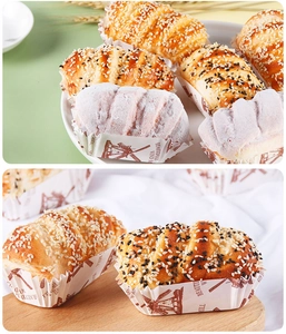Detailed view of assorted artificial bread and cupcakes with sesame and sugar toppings