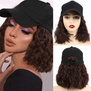 Detailed view of black baseball cap with integrated long wavy brown hair on female model