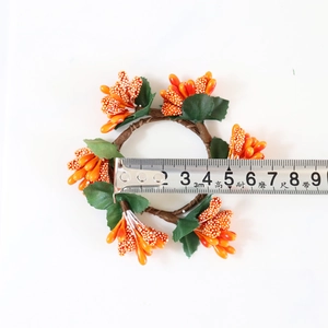 Orange berry napkin ring with green leaves and vine base for Halloween decor