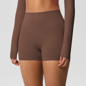Detail of high-waisted coffee brown yoga shorts with wide waistband for tummy control