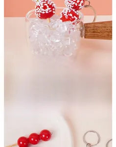 Detailed view of red candied hawthorn model with realistic texture and metal keychain