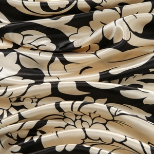 Elegant black and white floral satin square scarf featuring smooth silk-like texture folds