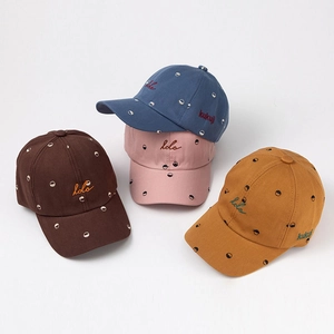 Kids vintage baseball caps in four colors with dot patterns and letter embroidery