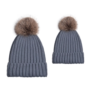 Parent-child gray-blue knit beanie set with brown faux fur pom poms for winter warmth