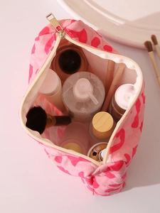 Pink heart pattern velvet makeup bag interior showing storage space and gold zipper