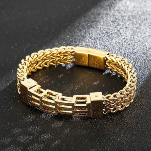 Close-up of golden double-layered titanium steel bracelet with geometric magnetic clasp