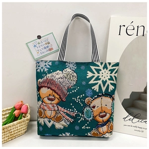 Winter festive tote bag with cute bear embroidery and striped handle detail view