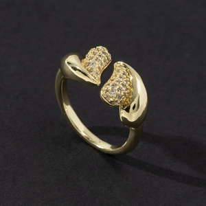 Close-up of adjustable gold ring with micro-pave zircon elements and polished finish