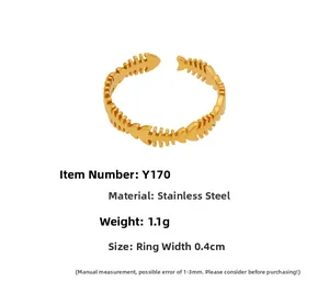 Detailed view of fishbone pattern open ring in 18k gold plated stainless steel