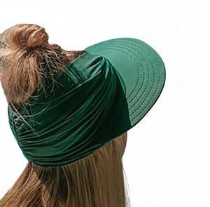 Detail of dark green sun visor hat with elastic pleated fabric for outdoor sports use