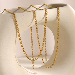 Minimalist 18K gold plated Figaro chain necklace for women displayed on a ceramic vase