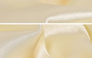 Macro shot of 18k gold plated stainless steel ring with smooth pale yellow satin texture