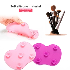 Macro detail of flexible silicone makeup brush cleaner mat with suction cup base design