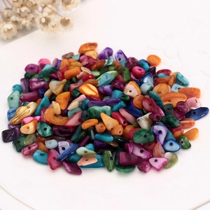Close-up of colorful irregular shell stone beads for DIY jewelry making and crafts
