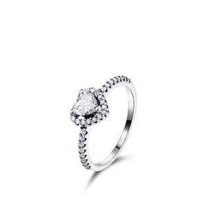 Elegant S925 sterling silver heart-shaped halo ring with pavé-set zircon stones on white background