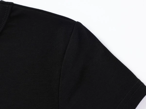 Close-up detail of reinforced shoulder stitching on black modal slim fit t-shirt