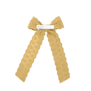 Ginger yellow swallowtail lace bow hair clip with floral embroidery on white background