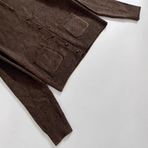 Dark brown knit cardigan sweater with round buttons and front pockets in vintage style