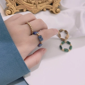 Handmade beaded natural stone rings set in blue green and brown with gold beads