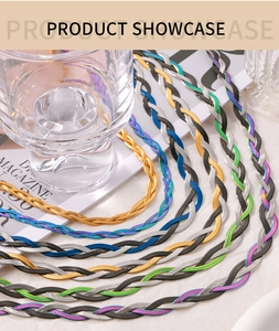Macro detail of multi-color braided snake chain necklaces in gold and gunmetal finish