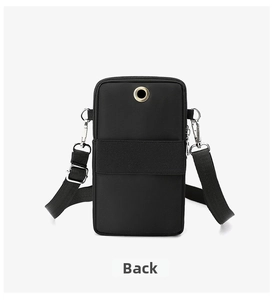 Detail view of the black phone bag back featuring a practical earphone hole and strap