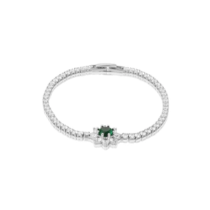 Macro detail of silver tennis bracelet with green emerald flower and zircon inlay