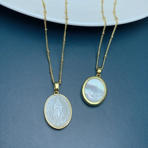 Oval Guadalupe necklace with natural white shell pendants on a gold beaded chain
