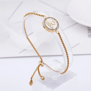 Adjustable gold titanium steel bracelet with pavé-set letter O and heart engraving
