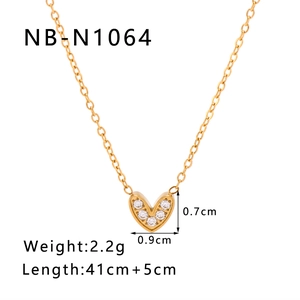 Gold titanium heart necklace with cubic zirconia and size dimensions on white background