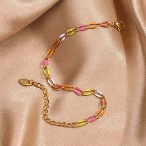 Detailed macro view of 18K gold plated stainless steel bracelet with colorful enamel links