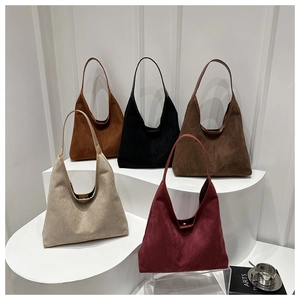 Detailed row of suede hobo tote bags in beige, burgundy, brown, and black colors