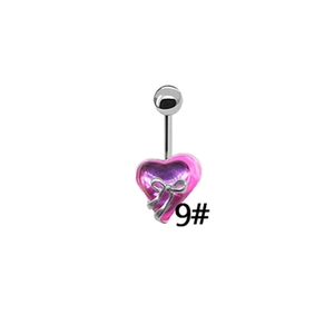 Detail shot of heart-shaped belly button ring with purple gradient and silver bow charm