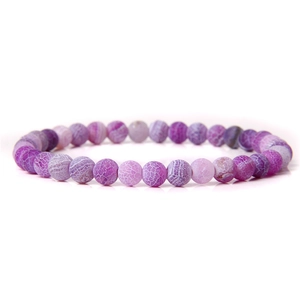 Macro shot of 6mm purple dragon vein agate beaded bracelet with natural stone texture