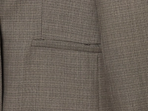 Macro detail of high-quality brown-gray twill fabric texture and pocket stitching of the suit