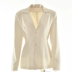 Detail of cream white long sleeve blazer featuring classic three-button closure and lapels