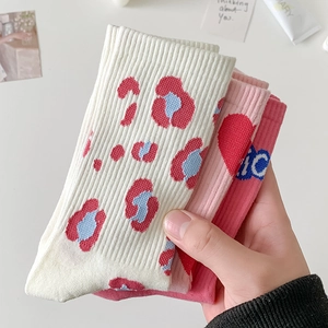 Pink crew socks set with heart leopard and letter patterns in a minimalist style