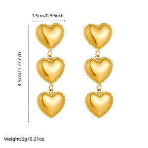 Polished gold heart drop earrings in stainless steel with triple heart dangle design
