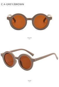Detail view of round vintage kids sunglasses in matte mocha grey and brown lenses