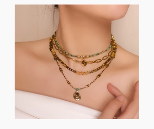 Close-up of layered tiger eye stone bead necklace with a round gold pendant for women