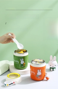 Detail of colorful stainless steel thermal soup cups with Miffy motifs and spoons