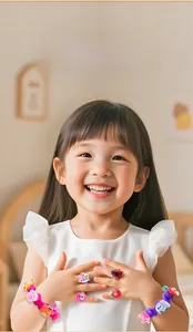Girl wearing a colorful DIY silicone jewelry set with cartoon animal rings and bracelets