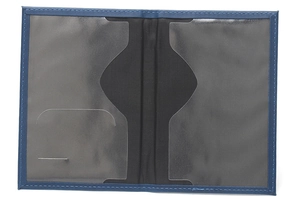 Detail view of the open faux leather passport holder showing dual interior clear card slots