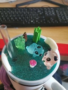 Detail of 40oz cup lid with 3D pandas, bamboo, and glitter acrylic nameplate decoration