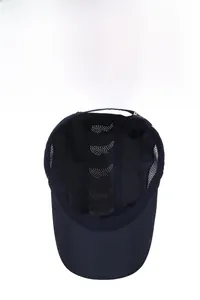Detail view of breathable laser-cut vents and mesh interior of the navy sports cap
