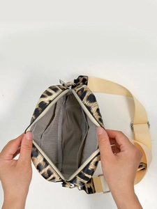 Crossbody leopard print square bag with nylon strap and silver metal zipper closure