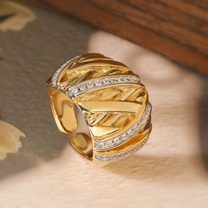 Luxe gold-plated wavy open ring featuring rows of sparkling pavé zircon stones