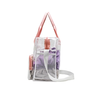 Side view of large transparent PVC beach bag with pink straps and mesh pocket detail