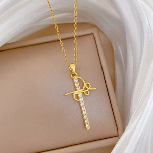 Elegant gold titanium steel necklace with a hollow cross pendant and clear crystals