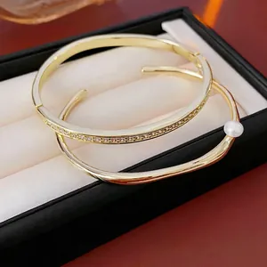 Elegant gold-plated geometric bracelet set with zircon stones and pearl accents